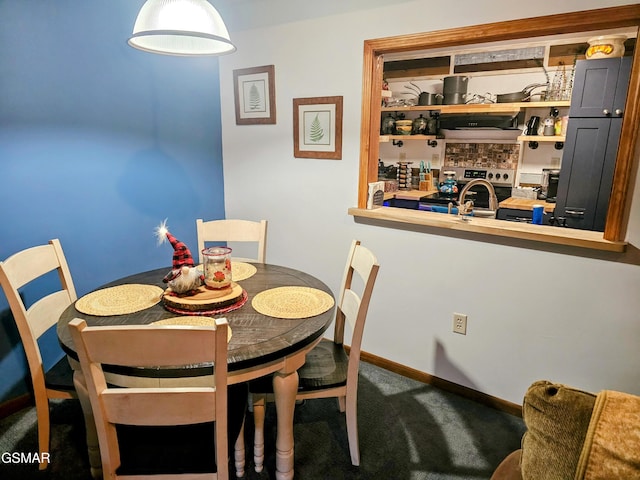 dining area featuring carpet