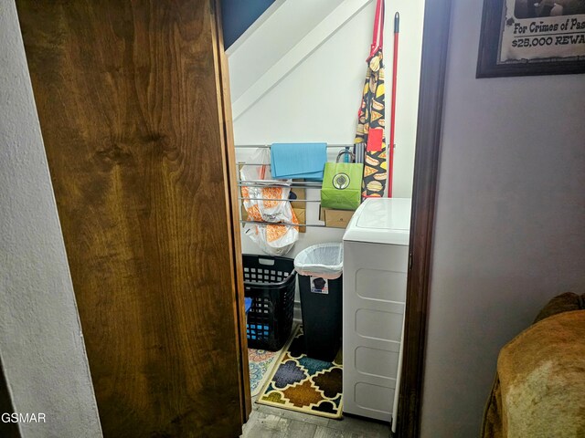 laundry room featuring washer / dryer and wood-type flooring