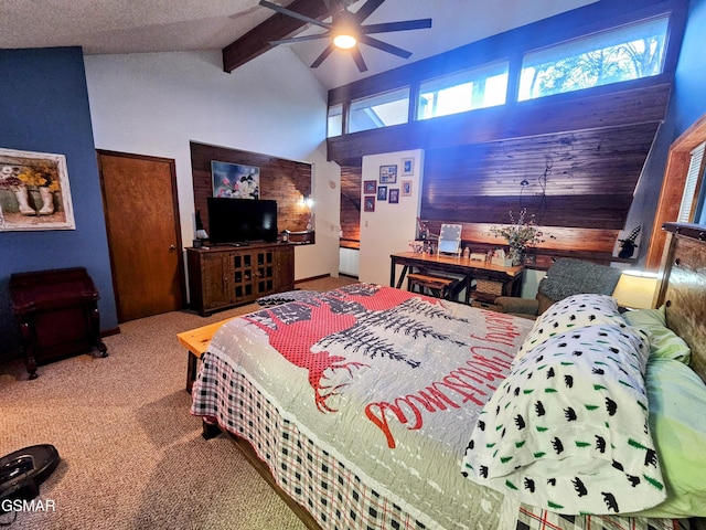 carpeted bedroom featuring multiple windows, vaulted ceiling with beams, and ceiling fan