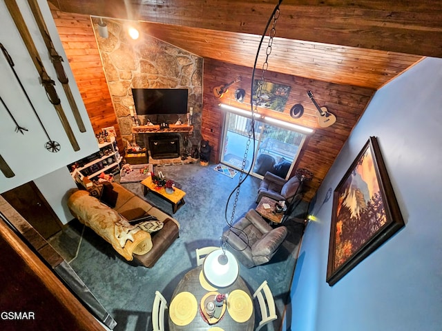 living room featuring wooden ceiling and vaulted ceiling