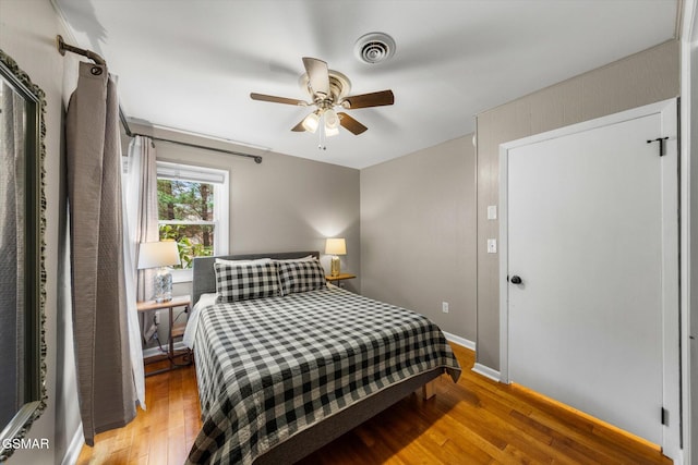 bedroom featuring wood-type flooring and ceiling fan