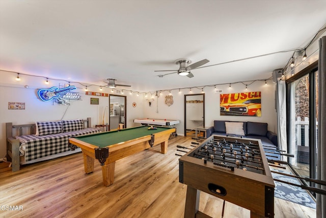 recreation room featuring ceiling fan, light wood-type flooring, and billiards