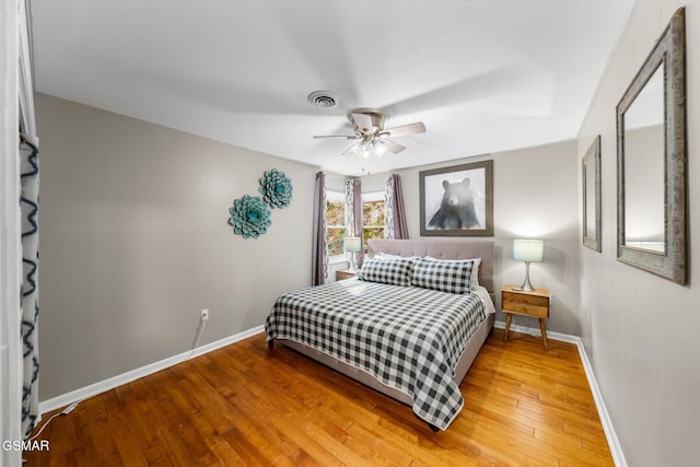 bedroom featuring hardwood / wood-style floors and ceiling fan