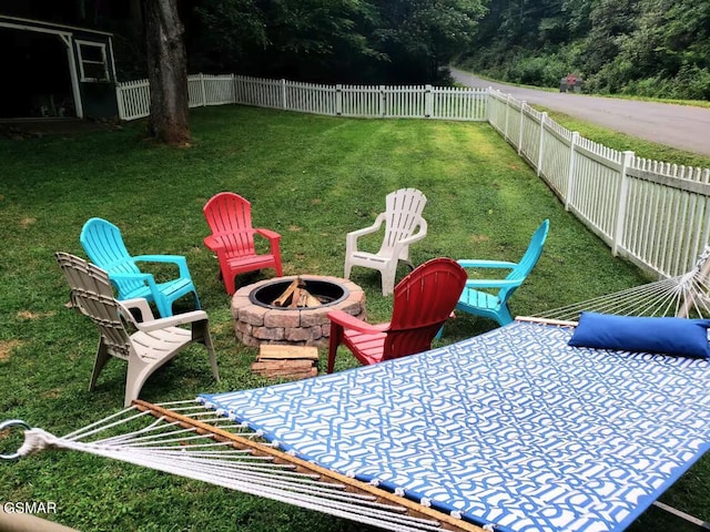 view of yard with an outdoor fire pit