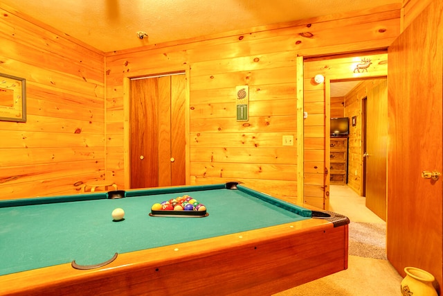 recreation room featuring light carpet, wooden walls, and billiards