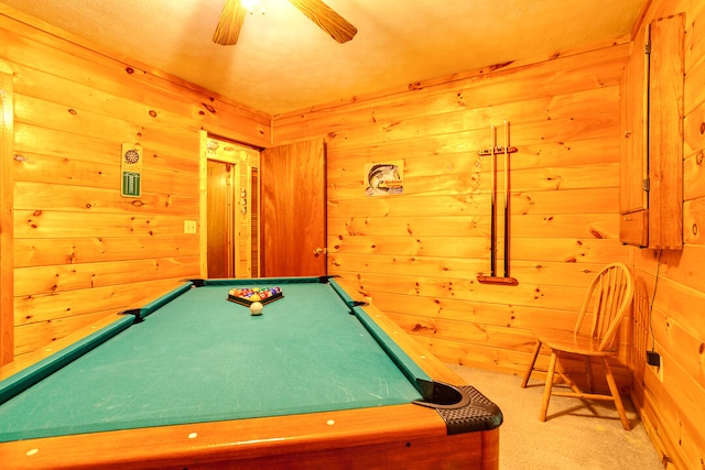 playroom with ceiling fan, carpet floors, wood walls, and billiards