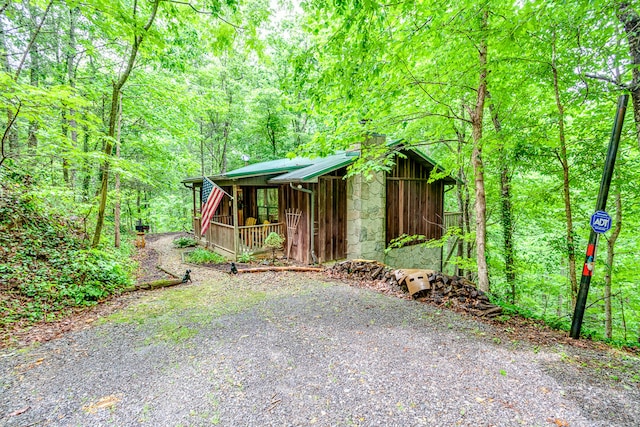 view of outbuilding with a porch