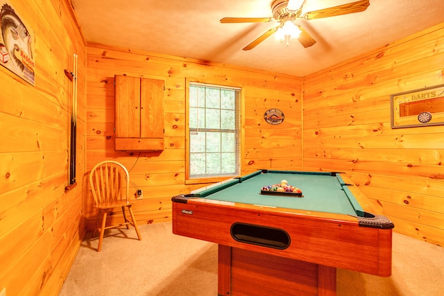 recreation room with light carpet, wooden walls, ceiling fan, and billiards