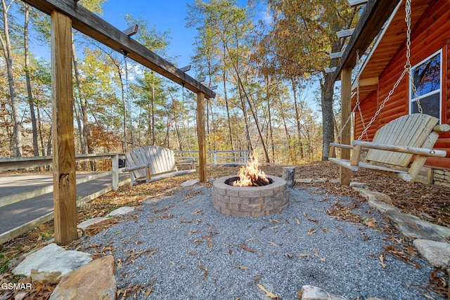 view of yard with an outdoor fire pit