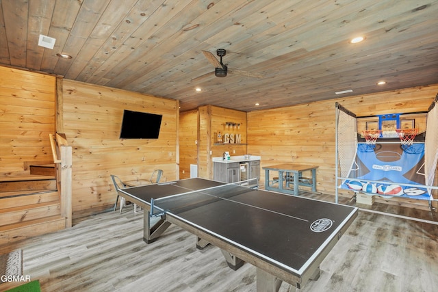 game room with hardwood / wood-style flooring, ceiling fan, wooden walls, and wood ceiling