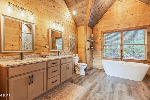 bathroom featuring hardwood / wood-style floors, wooden walls, vaulted ceiling, a tub to relax in, and wood ceiling