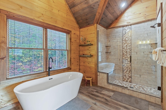 bathroom featuring hardwood / wood-style floors, vaulted ceiling, a healthy amount of sunlight, and wood ceiling