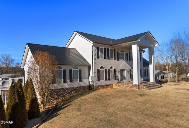 view of property exterior with a yard