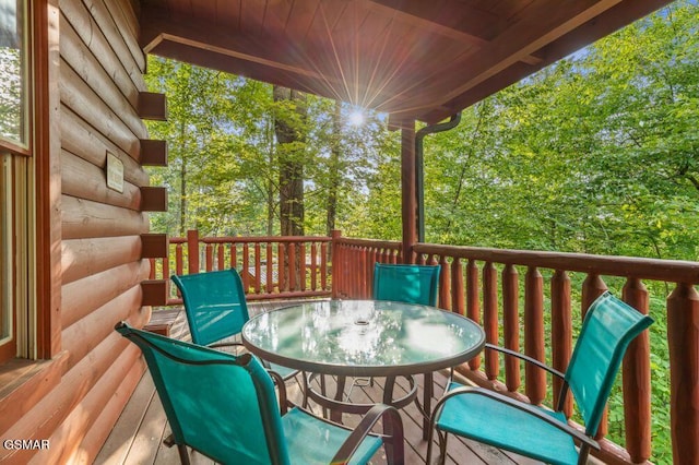 wooden deck with outdoor dining area