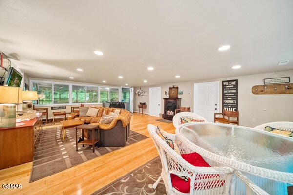 dining area featuring wood finished floors and recessed lighting