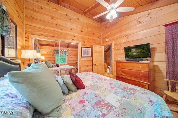 bedroom featuring wooden ceiling, beamed ceiling, and wooden walls