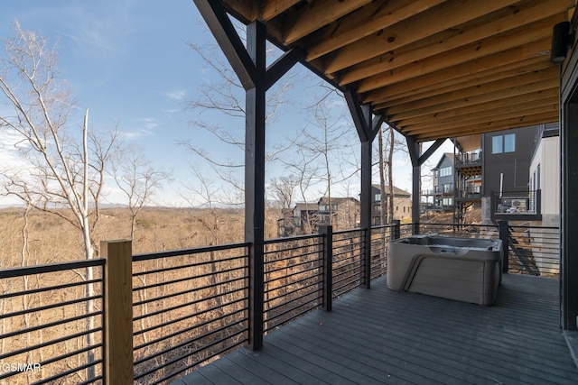 wooden terrace featuring a hot tub