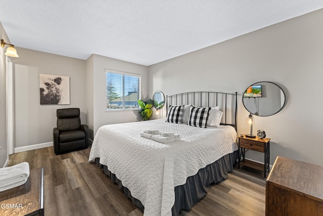 1260 Ski View Dr Unit 3308, Gatlinburg, TN 37738 - bedroom featuring a textured ceiling, baseboards, and wood finished floors