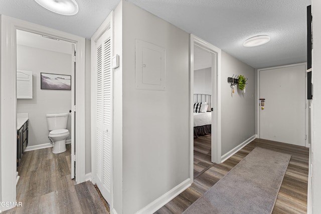 1260 Ski View Dr Unit 3308, Gatlinburg, TN 37738 - hall with baseboards, a textured ceiling, and wood finished floors