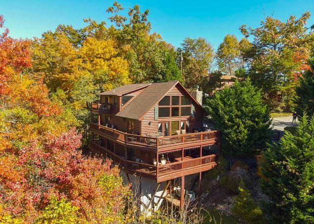 back of house with a deck