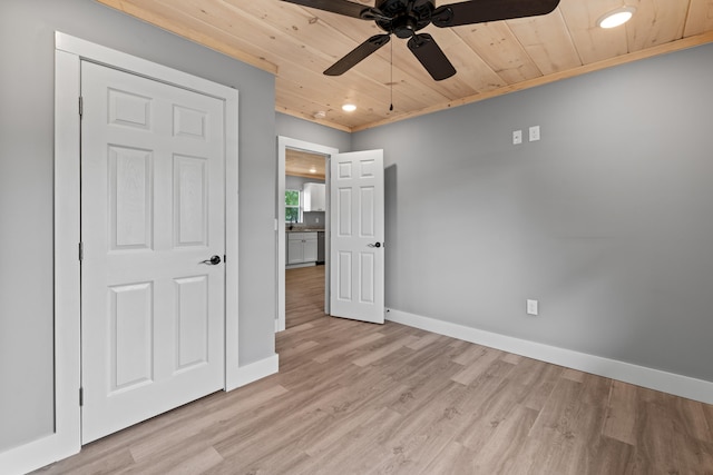 unfurnished bedroom with ceiling fan, light wood-type flooring, crown molding, and wood ceiling