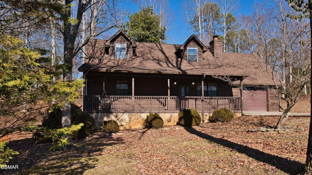 view of front of house featuring a garage and covered porch