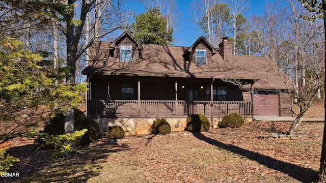 view of front of house featuring a garage and covered porch