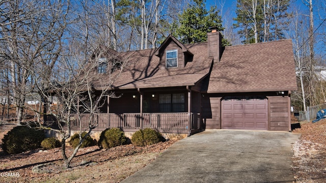 view of front facade featuring a garage and covered porch