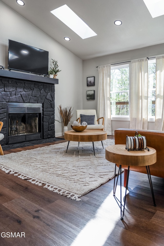 2760 Hawks View Trl, Pigeon Forge, TN 37876 - living room with a skylight, wood finished floors, a stone fireplace, recessed lighting, and lofted ceiling