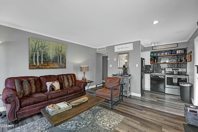 living room featuring dark hardwood / wood-style flooring and crown molding