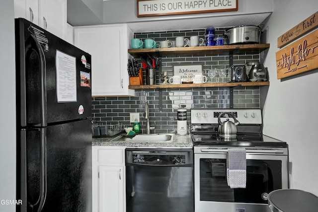 kitchen with decorative backsplash, sink, white cabinetry, and black appliances