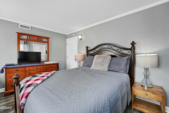 bedroom featuring a textured ceiling, dark hardwood / wood-style flooring, and crown molding