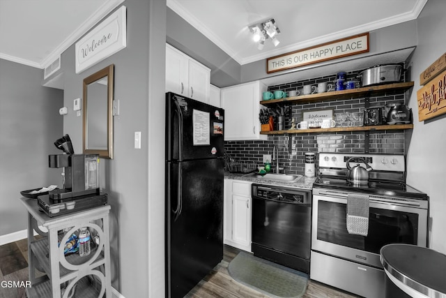 kitchen with black appliances, backsplash, sink, and white cabinetry