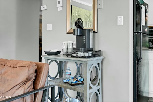 interior details featuring black refrigerator