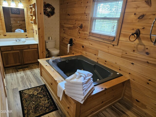 2114 Rabbit Point Way, Sevierville, TN 37876 - full bath with vanity, a tub with jets, and wood finished floors