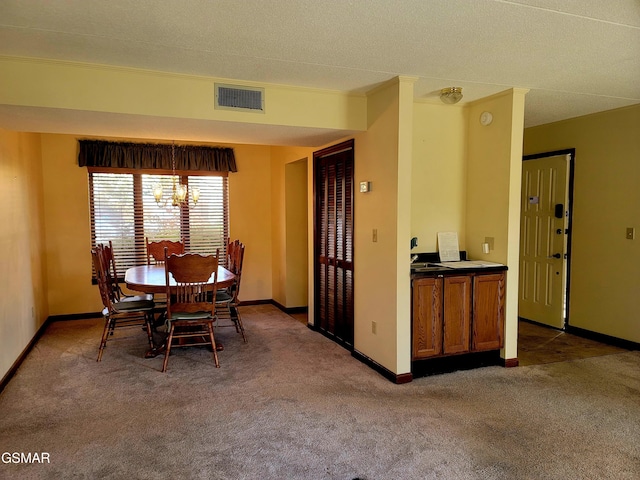 carpeted dining space with a notable chandelier