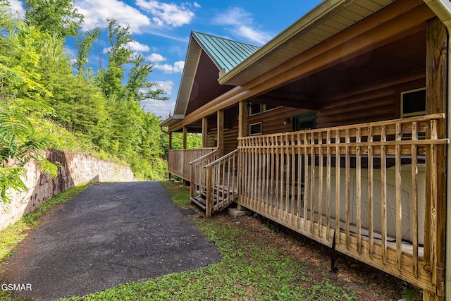 1792 Paulas Huskey Cir, Sevierville, TN 37876 - view of side of property featuring metal roof, a standing seam roof, a wooden deck, and fence