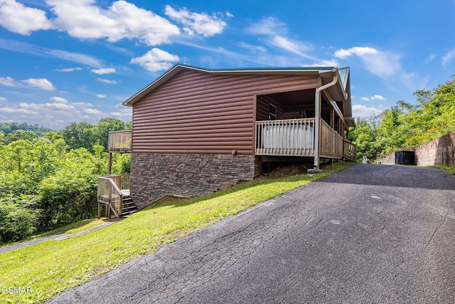 1792 Paulas Huskey Cir, Sevierville, TN 37876 - view of home's exterior with stairway, stone siding, and log veneer siding