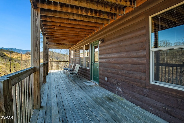 wooden terrace with a mountain view