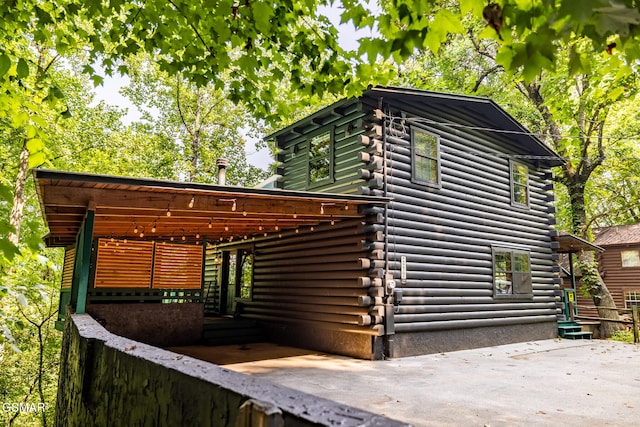 view of home's exterior featuring log siding
