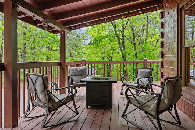 deck with an outdoor fire pit