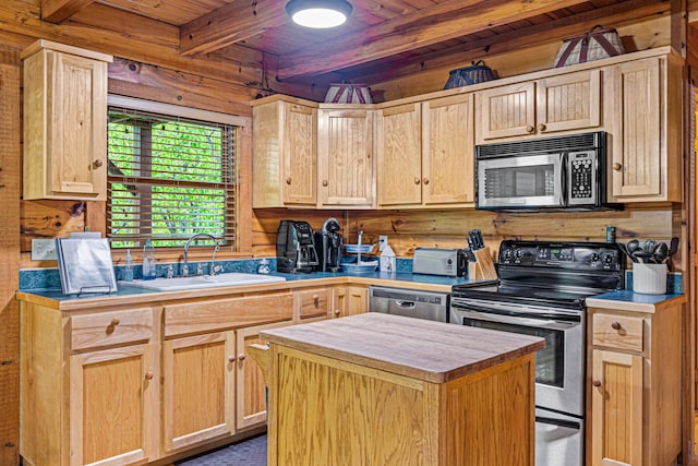 kitchen with beam ceiling, sink, light brown cabinetry, a kitchen island, and appliances with stainless steel finishes