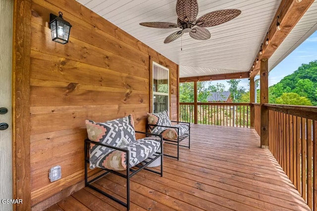 wooden terrace featuring ceiling fan