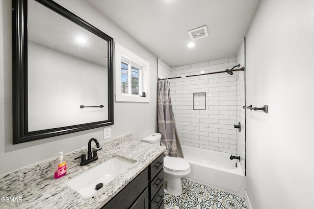 full bathroom with tile patterned flooring, shower / bath combination with curtain, vanity, and toilet