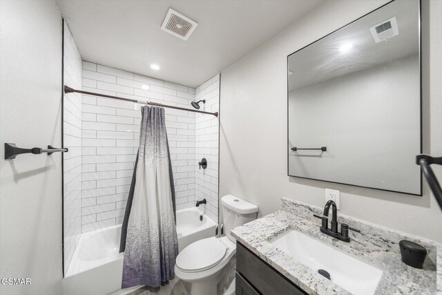 full bathroom featuring shower / bath combo with shower curtain, vanity, and toilet