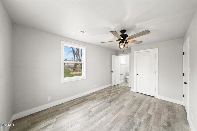 unfurnished bedroom with light wood-type flooring and ceiling fan