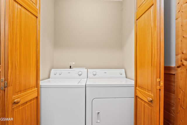 clothes washing area with washer and dryer