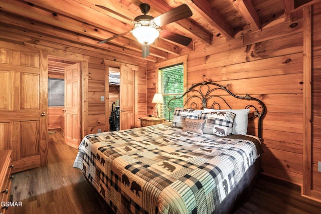 bedroom featuring beamed ceiling, wood finished floors, wooden walls, and wood ceiling