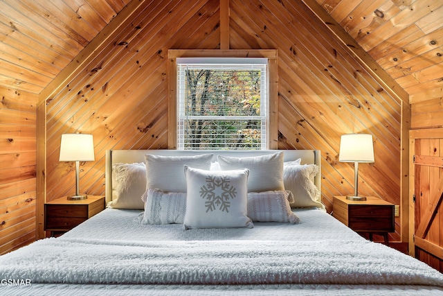 bedroom featuring lofted ceiling and wood walls