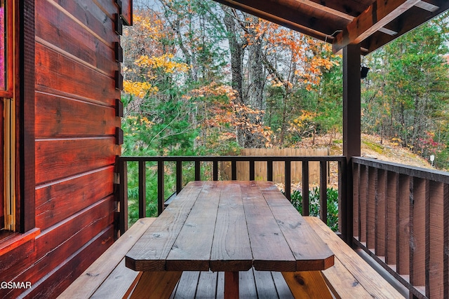 wooden terrace featuring outdoor dining area